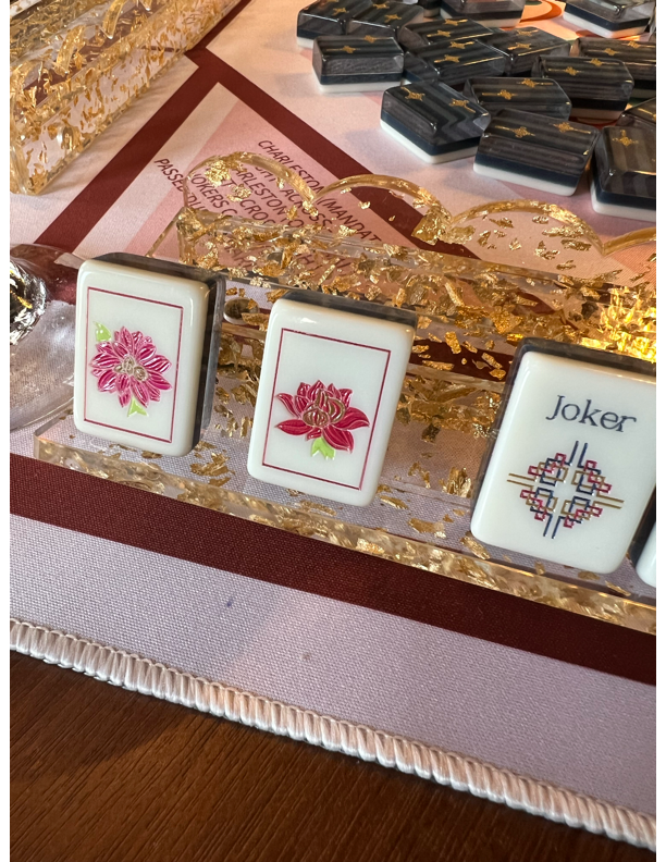 The Traditionalist mahjong set — hand-painted tiles with gold-flecked rack
